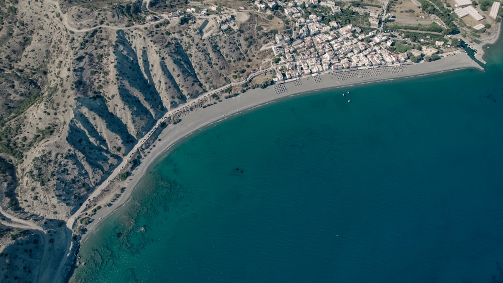 an aerial view of a beach and a city