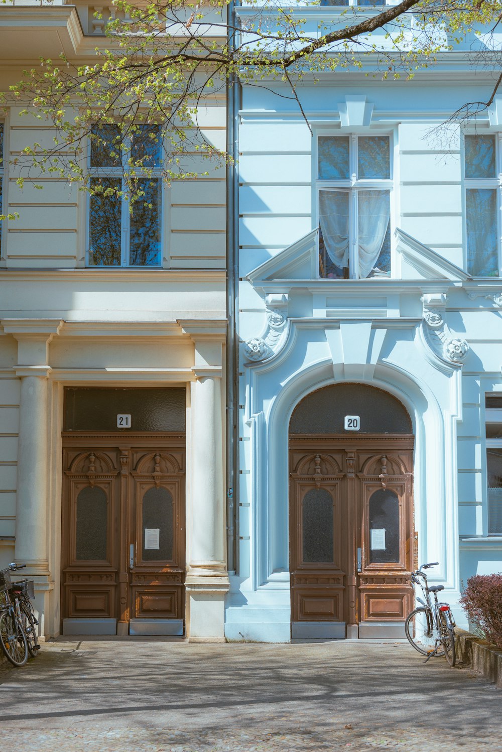 a blue building with a bicycle parked in front of it