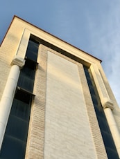 a tall building with a clock on the side of it