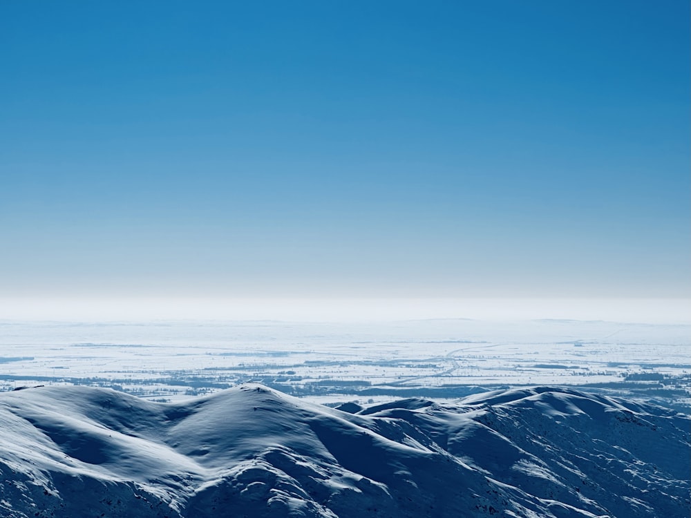 a view of a mountain range covered in snow