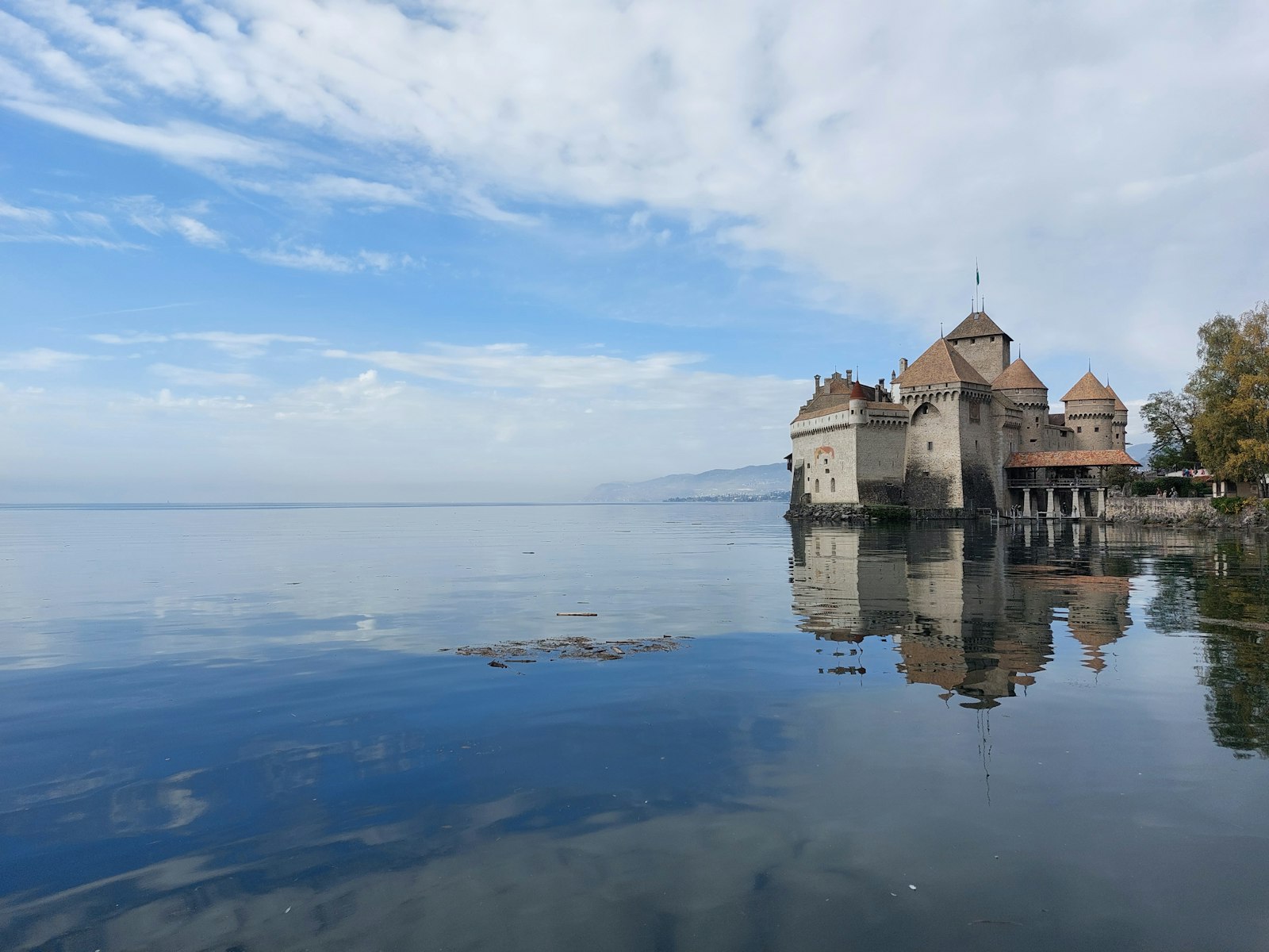 Château de Chillon reflected in the still waters of Lake Geneva near Montreux