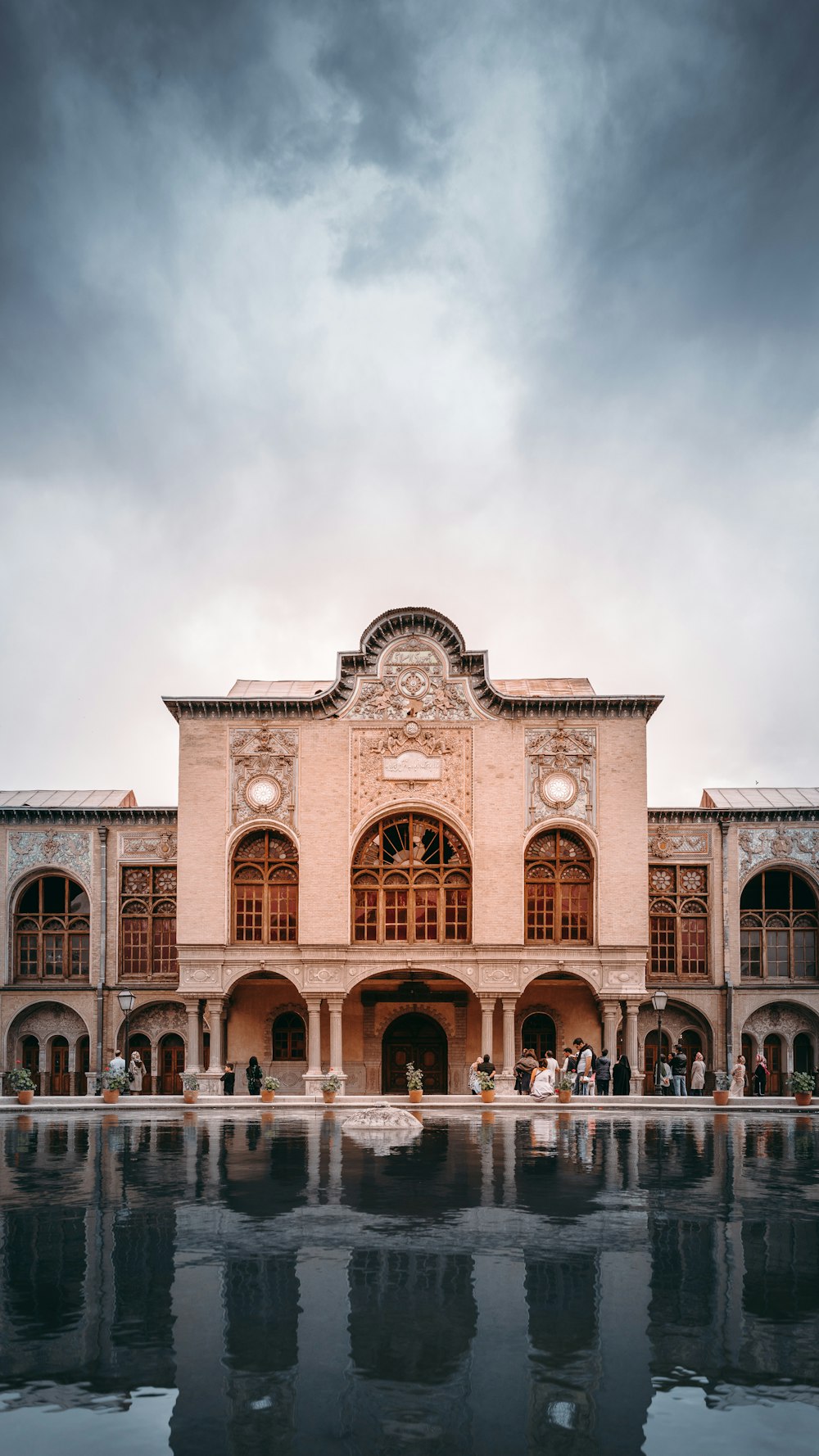 a large building with a fountain in front of it