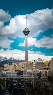 a very tall tower towering over a city