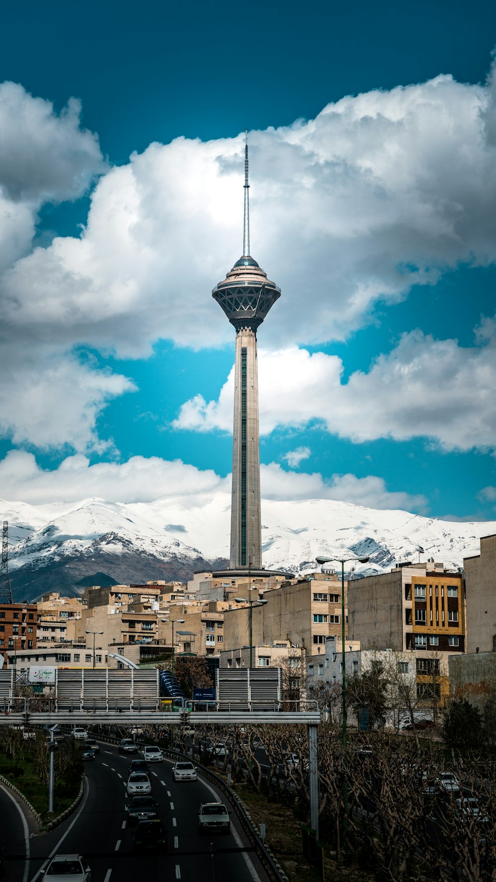 a very tall tower towering over a city