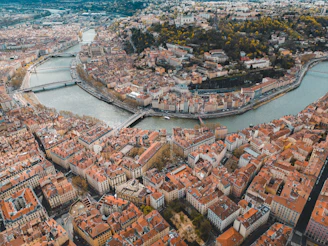 an aerial view of a city with a river running through it