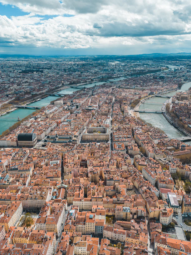 an aerial view of a city with a river running through it