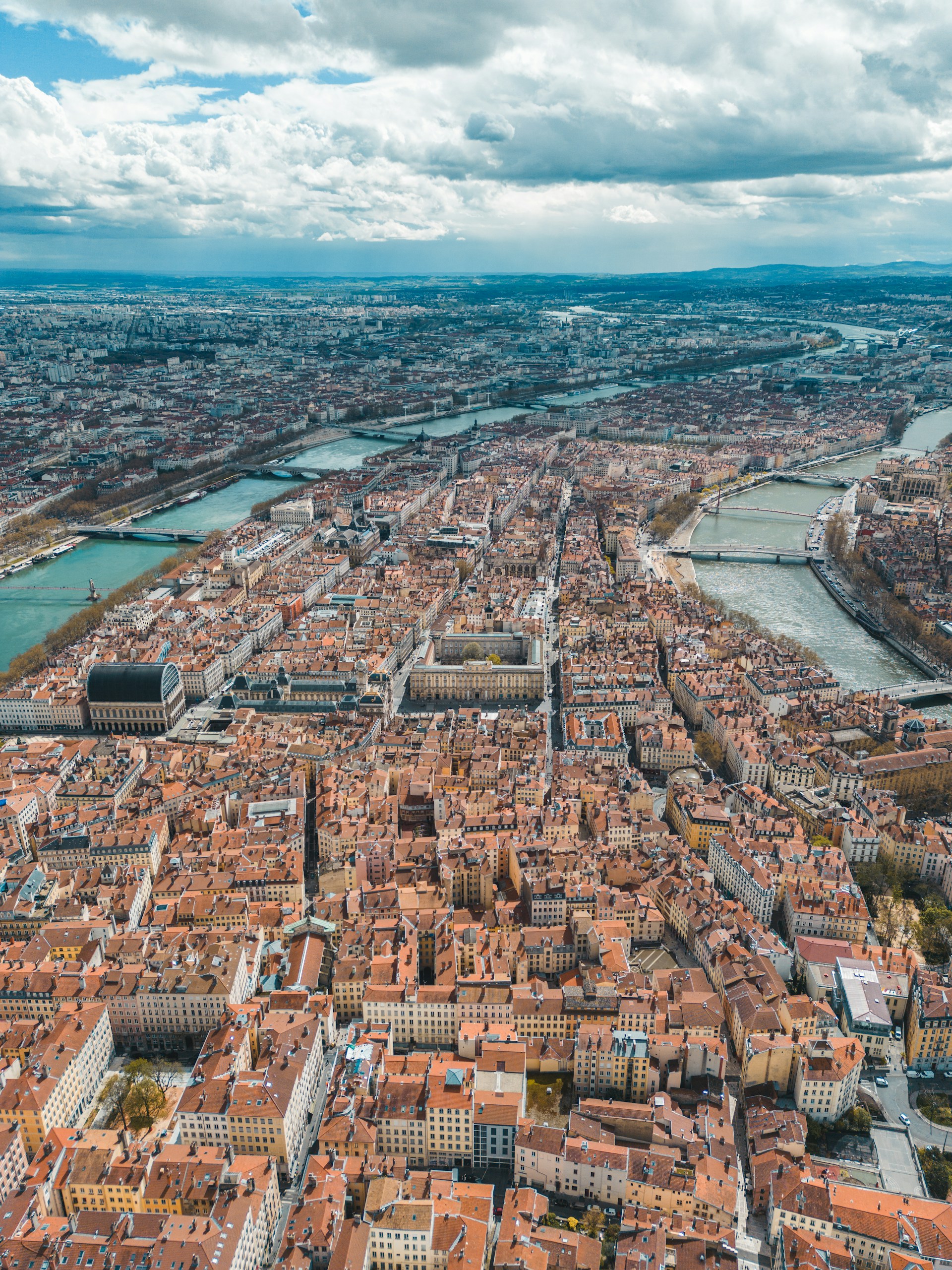 an aerial view of a city with a river running through it