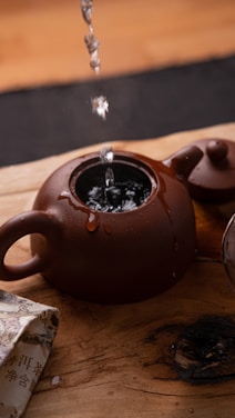 Water being poured into a teapot