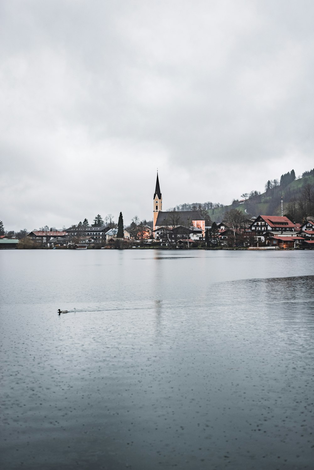 a large body of water with a church in the background