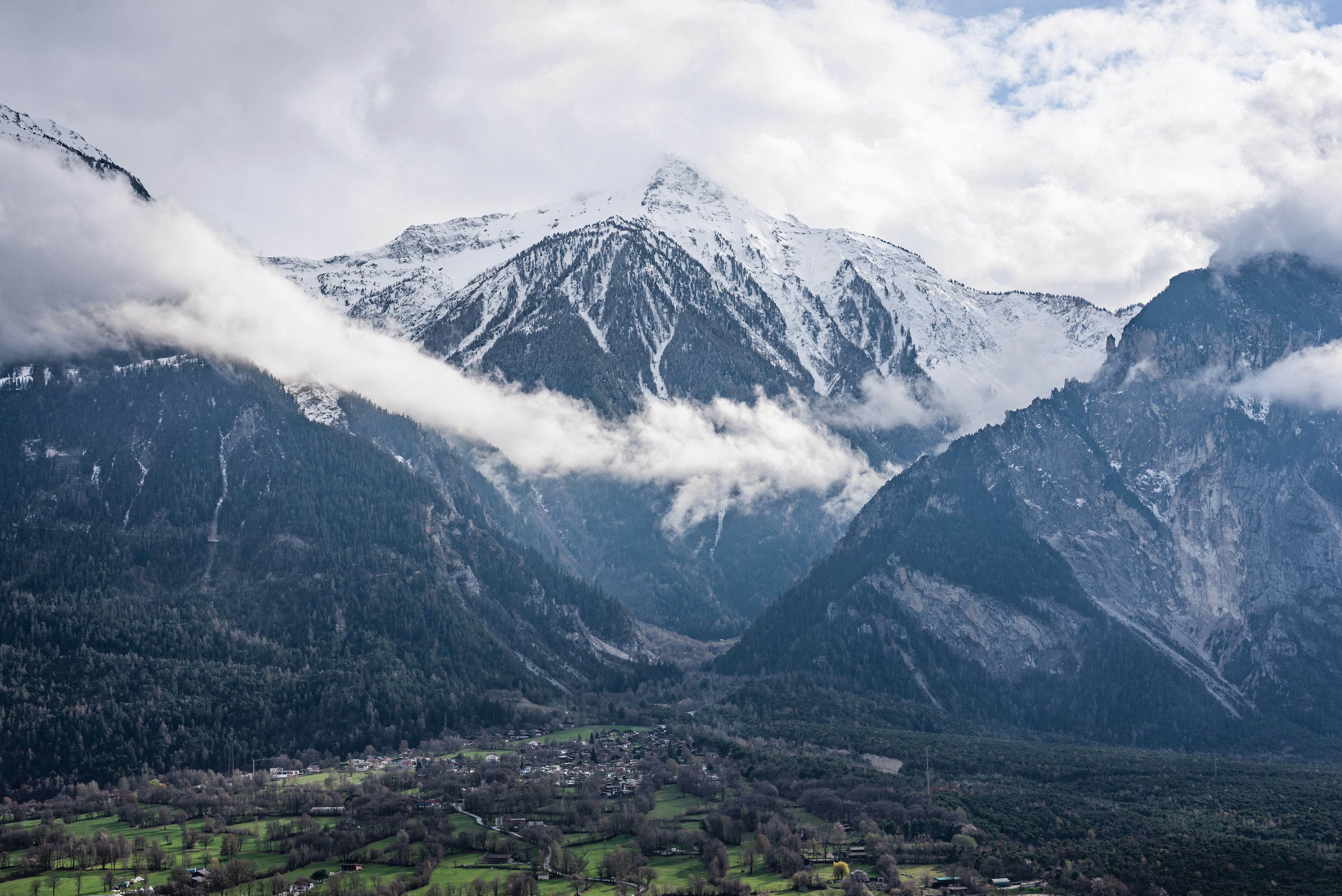 a view of a mountain range with a valley below