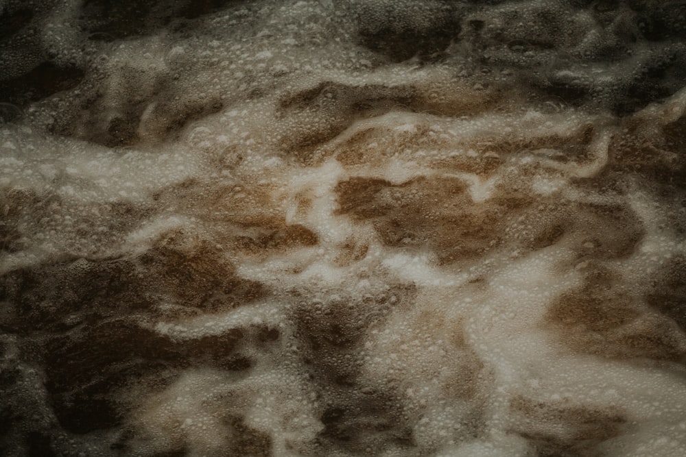 a close up of a brown and white substance