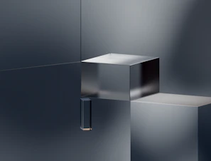 Minimalist corporate crystal awards arranged neatly on a sleek white surface