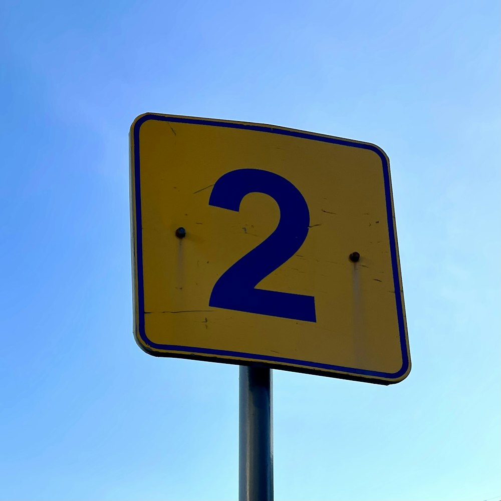 a street sign with the number two on it