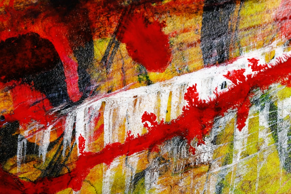 an abstract painting with red and yellow colors