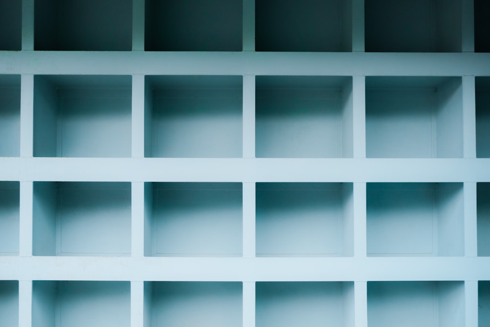 a white shelf filled with lots of empty shelves