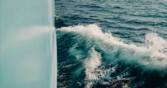 Waves splashing against the hull during an adventurous day at sea