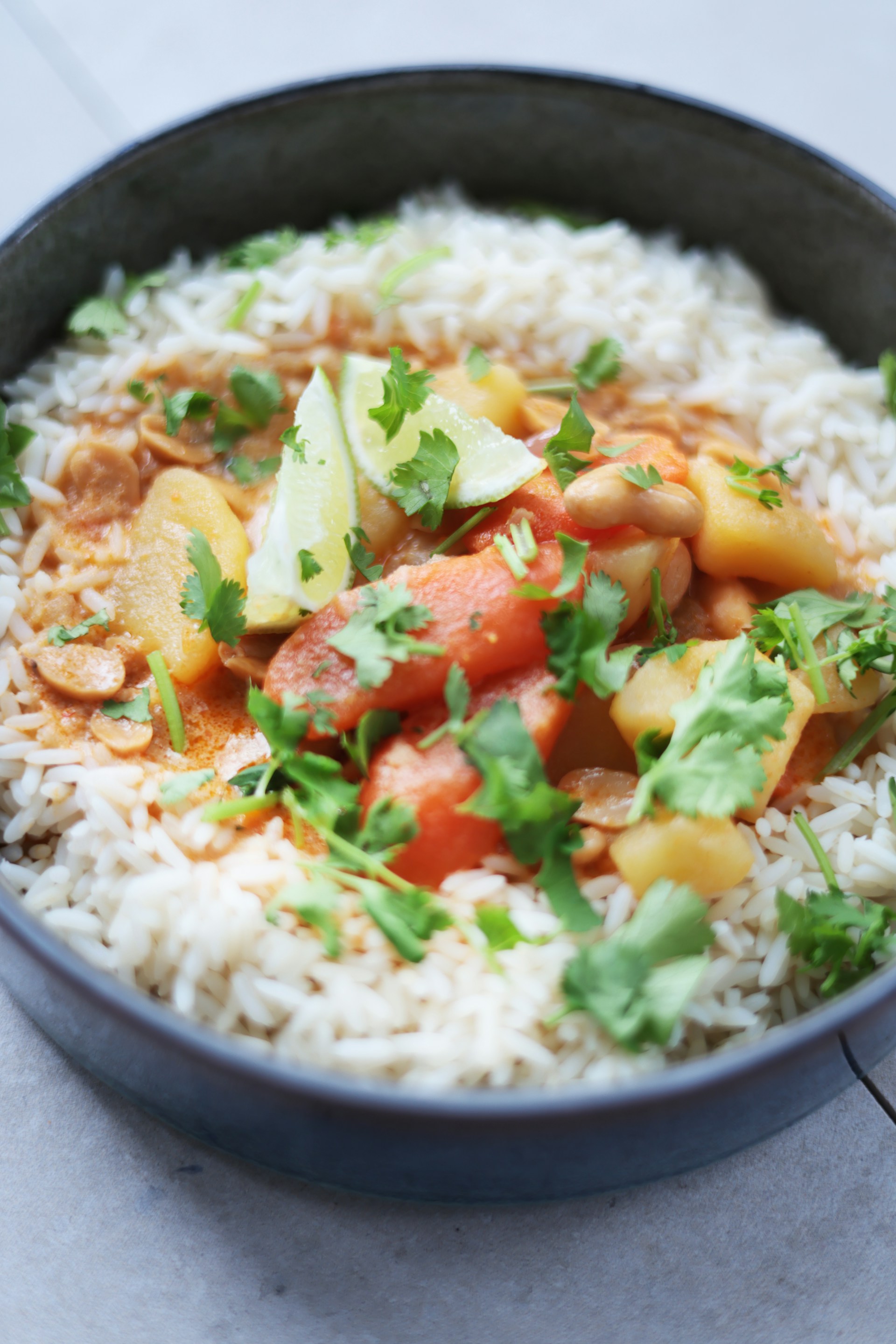 a bowl filled with rice and vegetables on top of a table