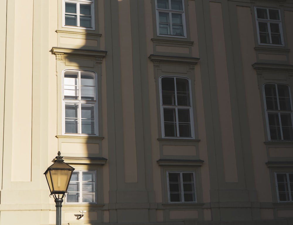 a street light in front of a tall building