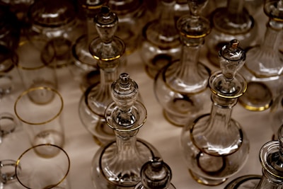 A collection of decants in varying sizes, displayed with soft natural light emphasizing their premium minimalism.