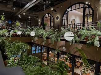 Cozy restaurant seating area with elegant artificial greenery enhancing the dining experience.