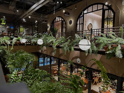 Cozy restaurant seating area with elegant artificial greenery enhancing the dining experience.