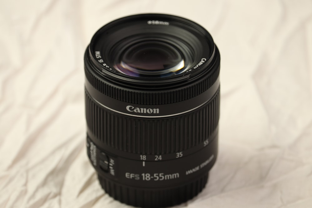 a close up of a camera lens on a white surface