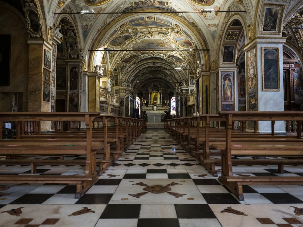 a church filled with lots of wooden benches