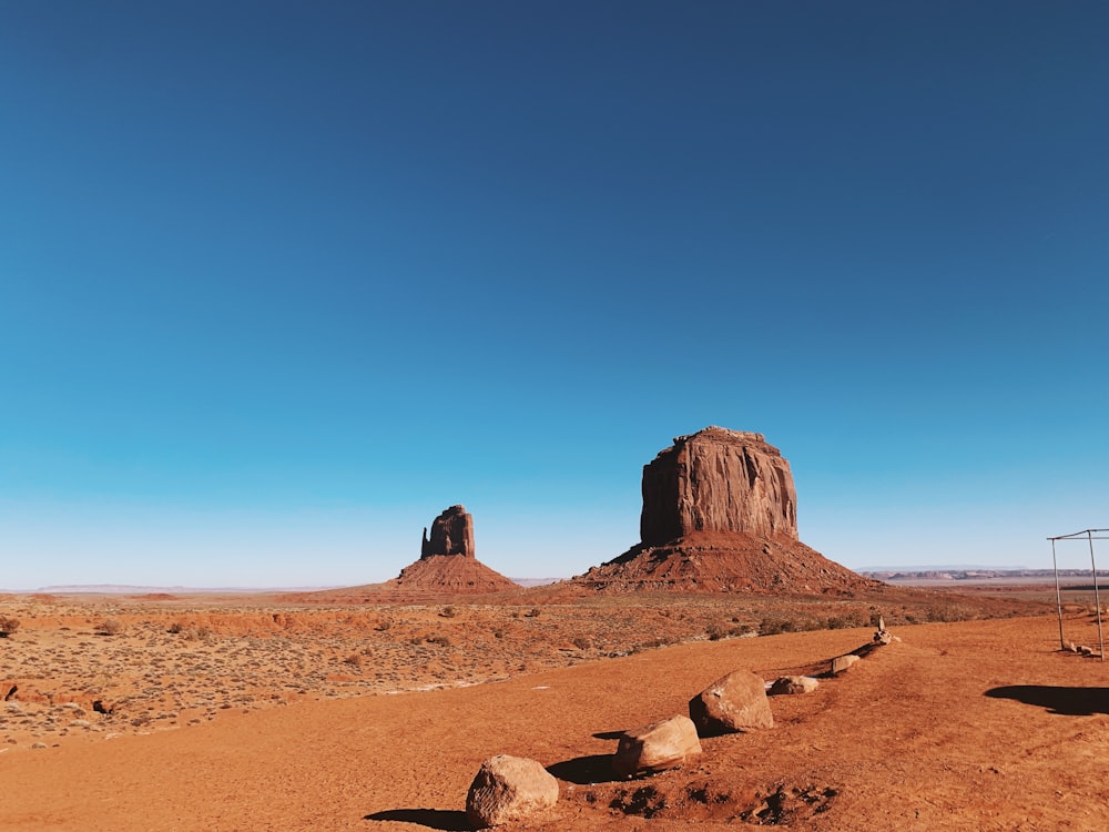 a dirt road in the middle of a desert