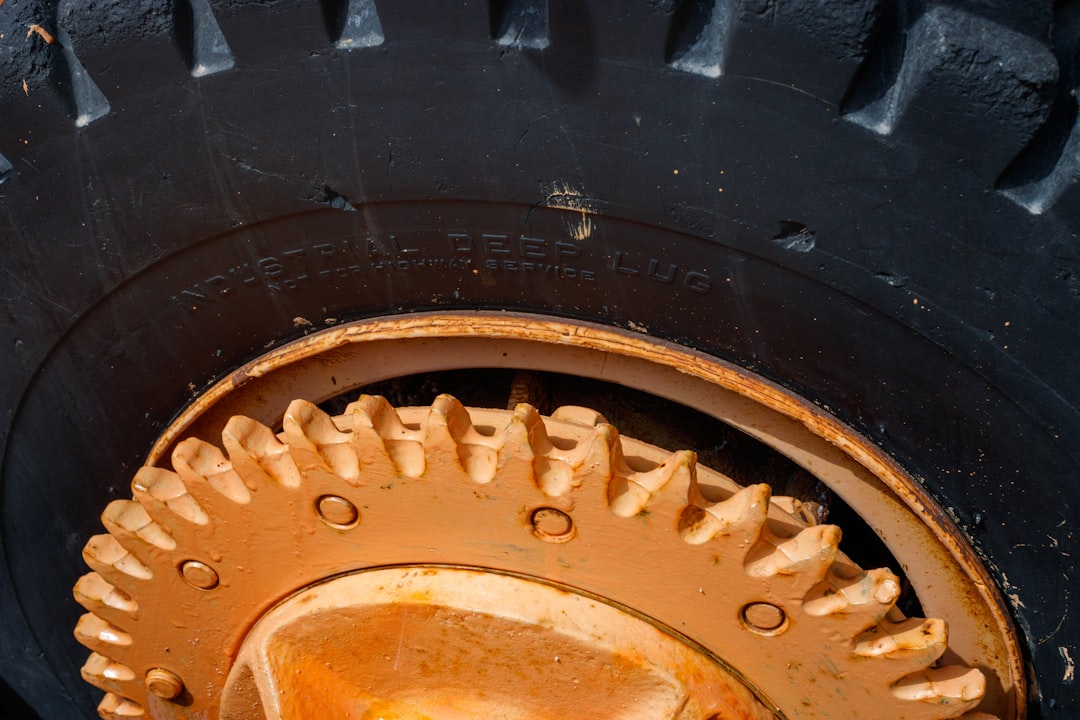 a close up of a tire on a vehicle, Old mining equipment at a historic mining remembrance center in Green River, Wyoming.