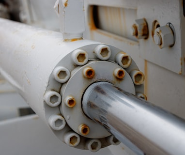 a close up of a white pipe on a machine
