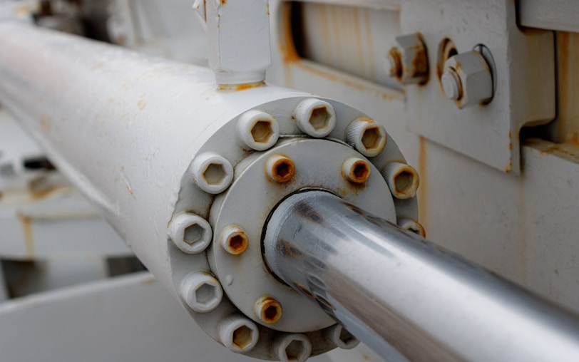 a close up of a white pipe on a machine