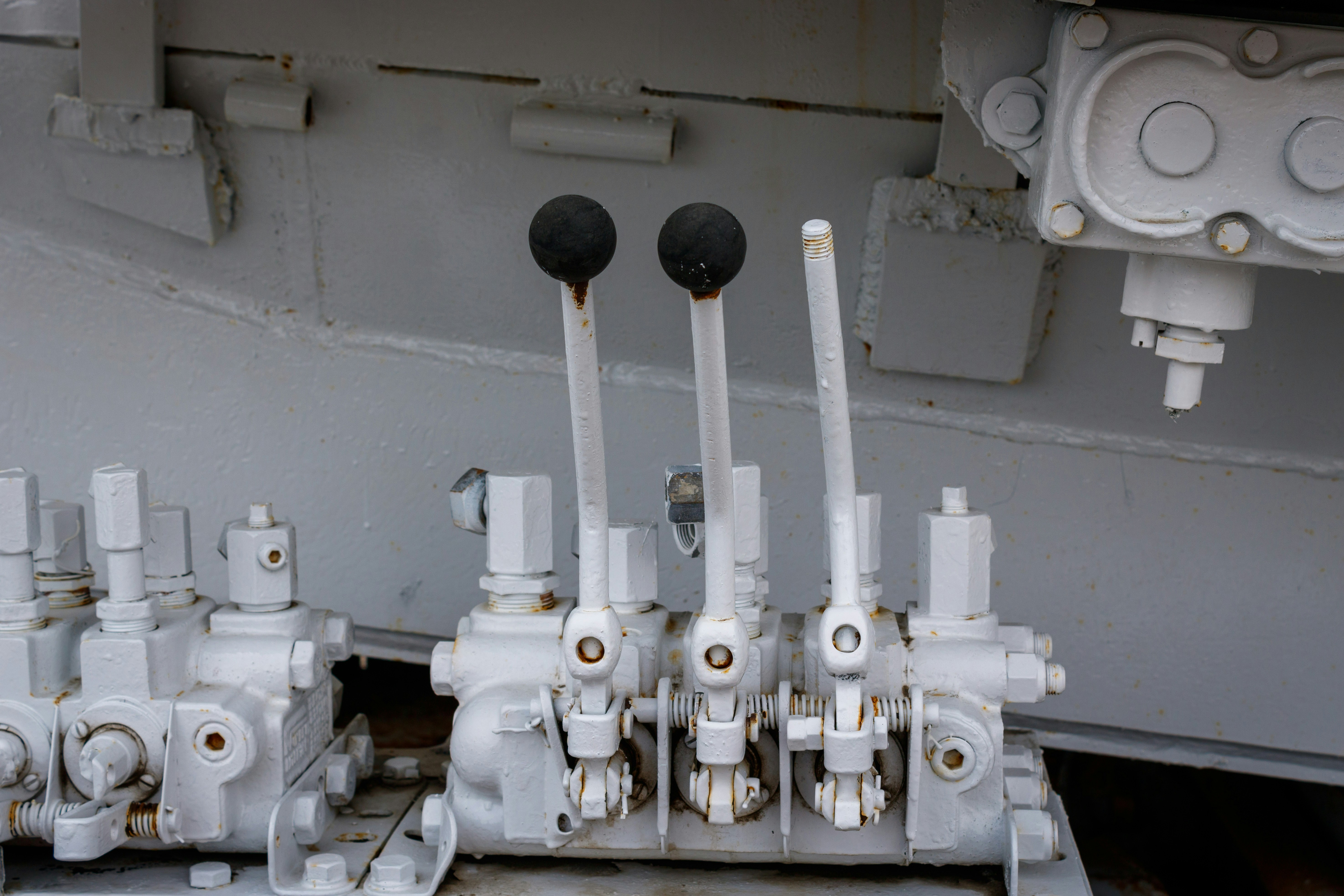 a bunch of pipes and valves on a ship