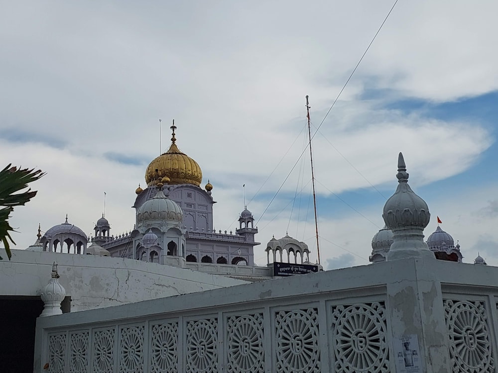 a large white building with a golden dome