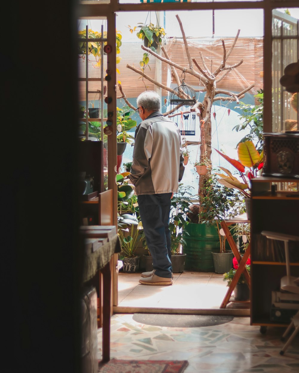 a man standing in the doorway of a house