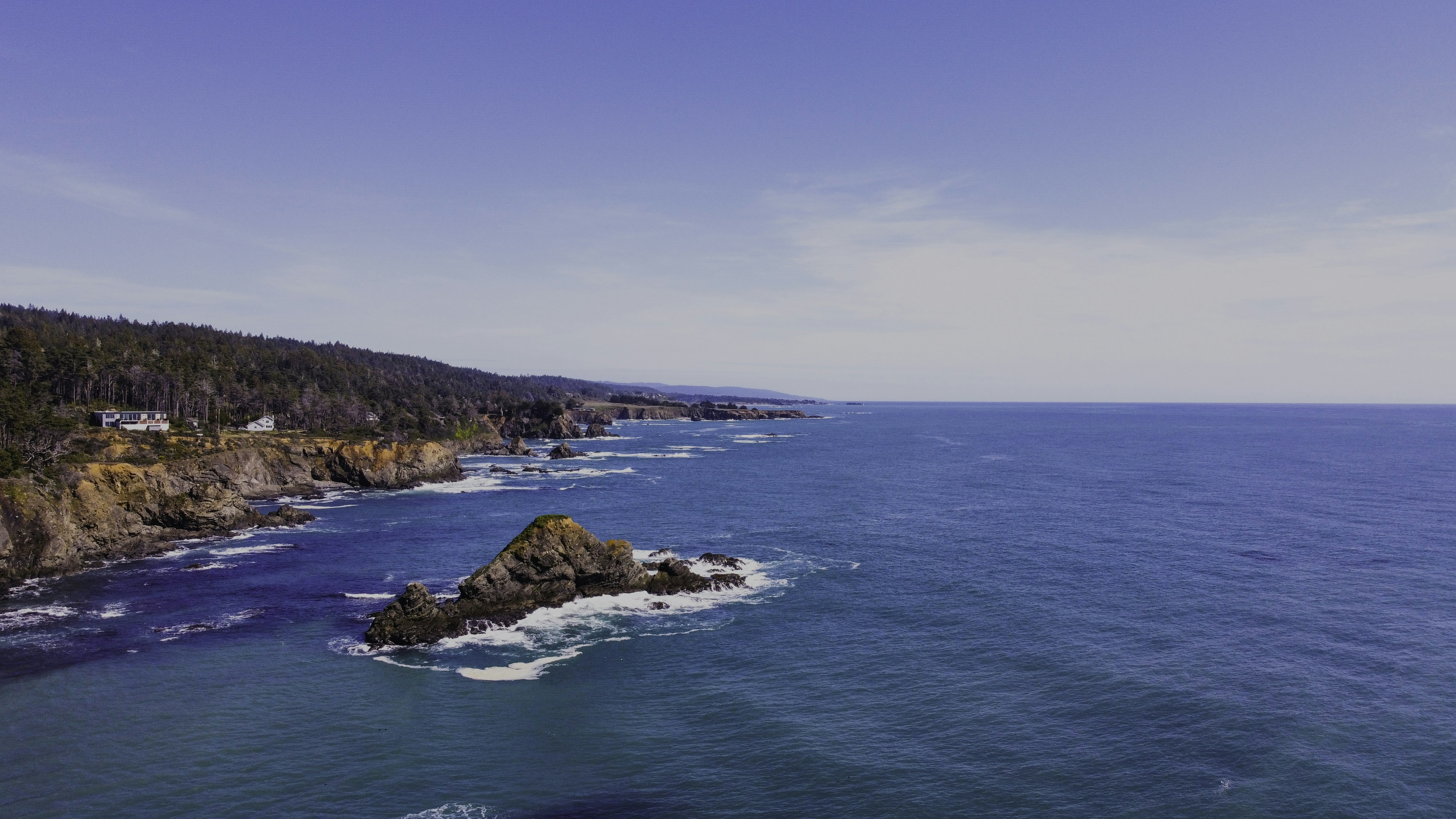 an aerial view of the ocean and coastline