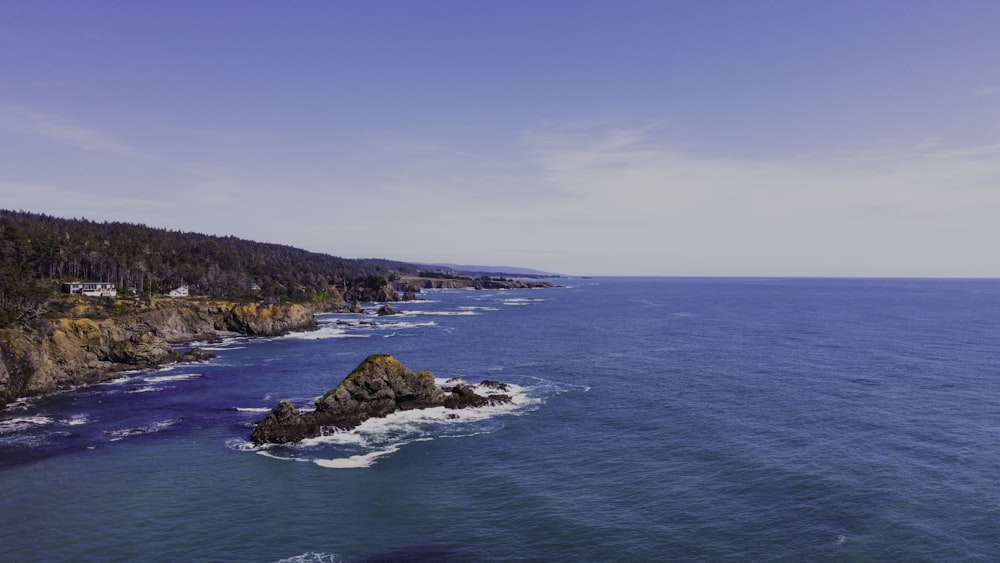 an aerial view of the ocean and coastline