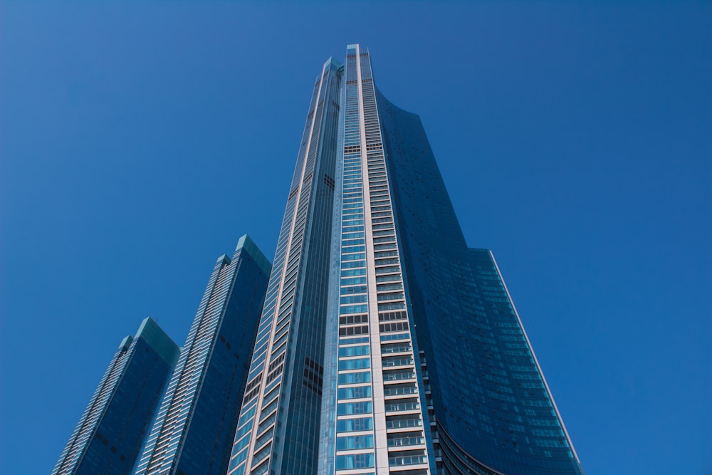 a very tall building towering over a city