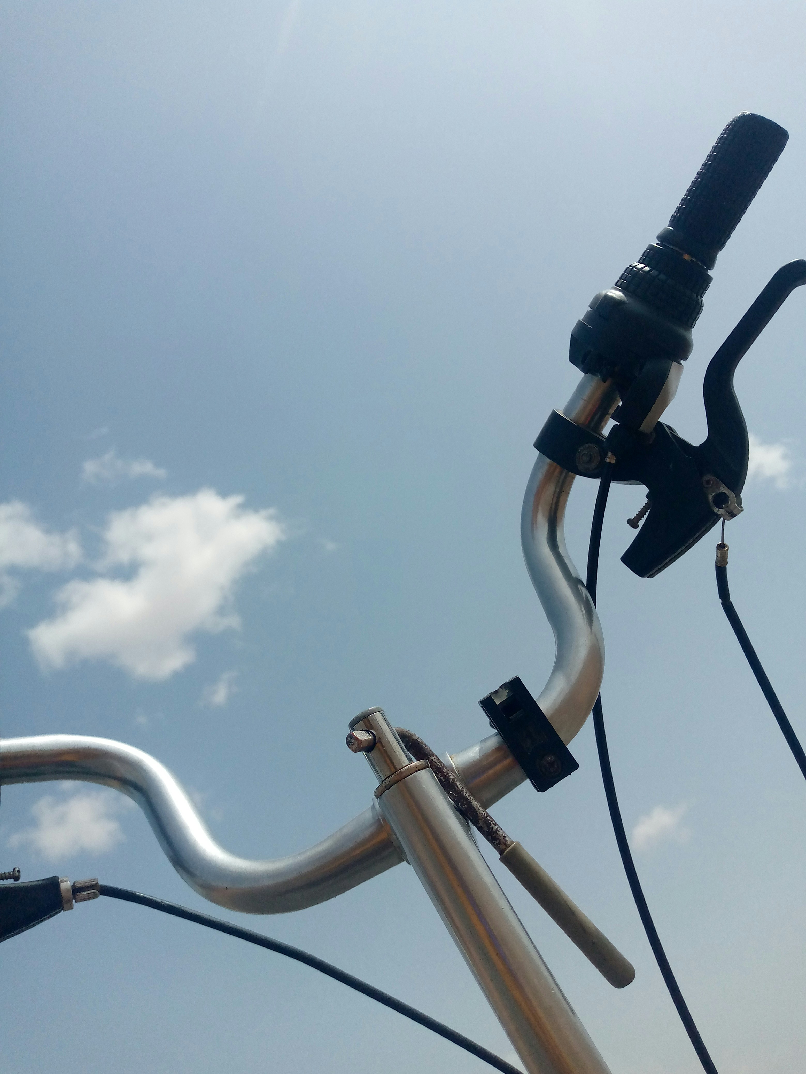 a close up of a metal pole with a sky background