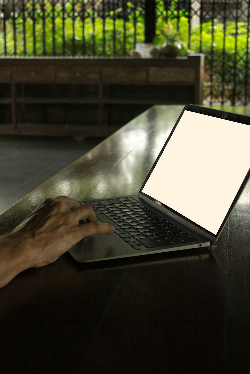 a person using a laptop computer on a table