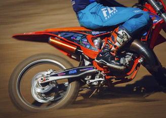 Dynamic shot of a motorcycle speeding on a winding road showcasing durable spare parts.