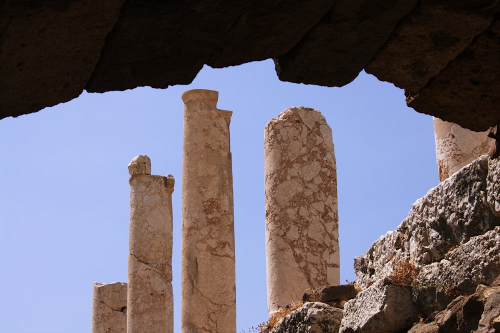 a group of stone pillars sitting next to each other