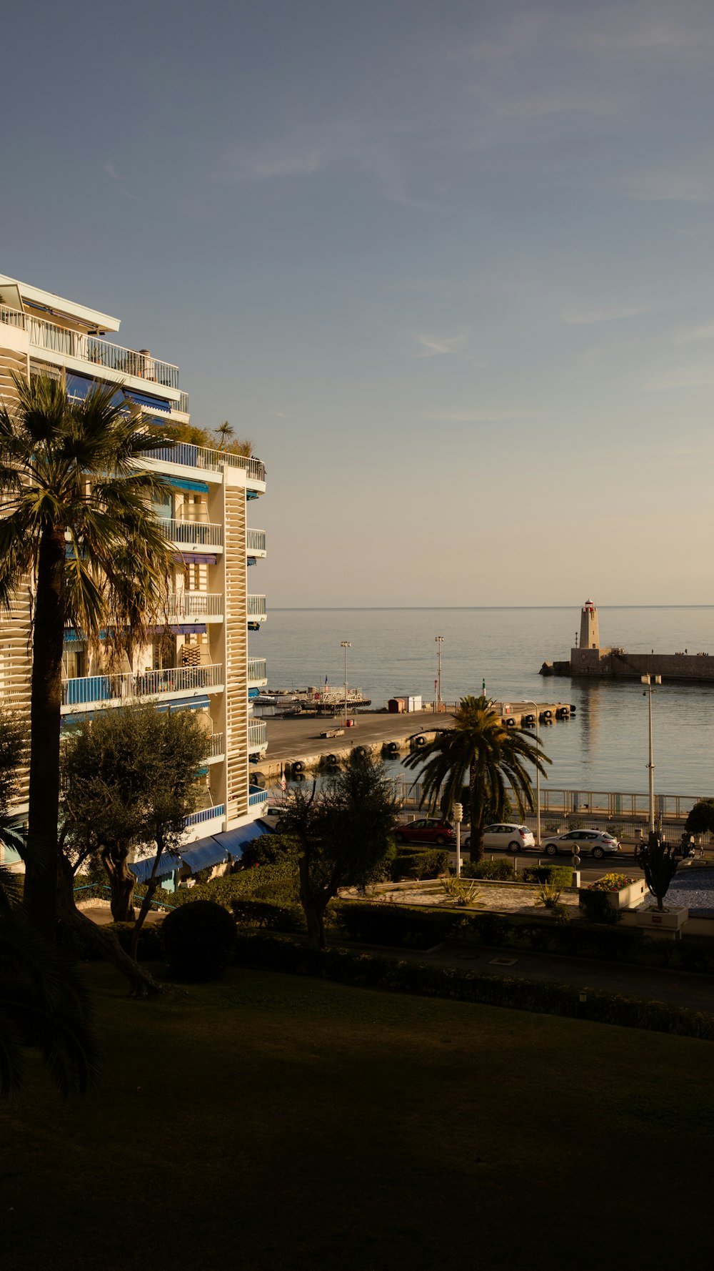 a view of the ocean from a balcony of a hotel