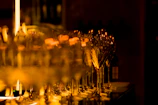 Close-up of crystal-clear wine glasses catching soft natural light.