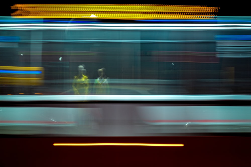 a blurry photo of a woman sitting on a bus