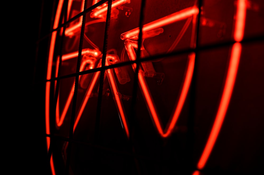a close up of a red light in a dark room