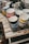 An assortment of colorful mugs with patriotic designs displayed on a wooden table.