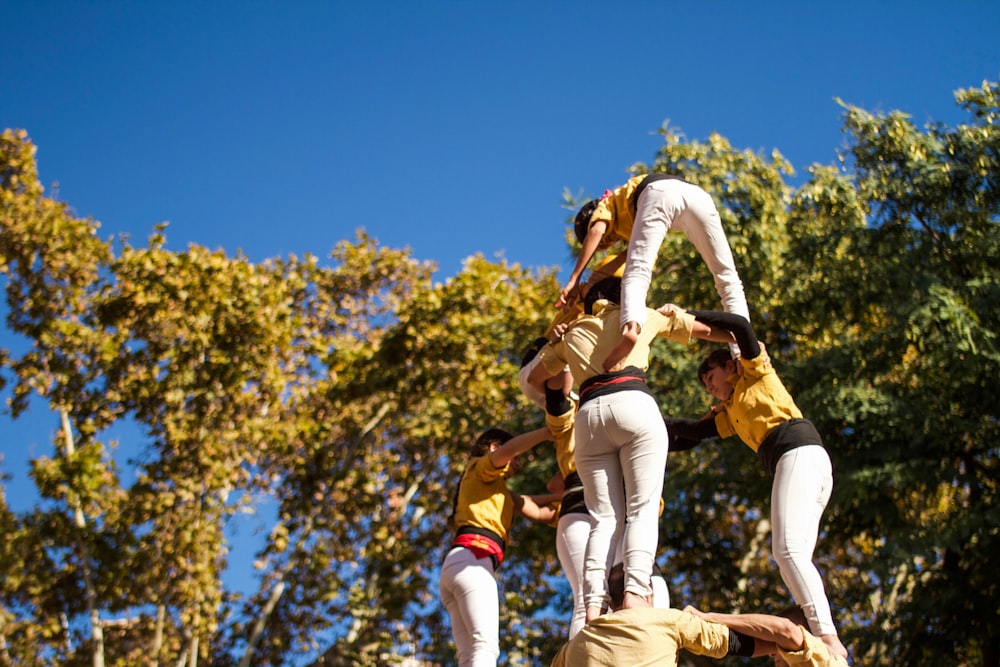 a group of people standing on top of each other