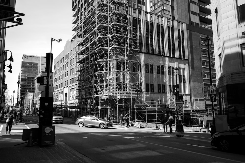 a black and white photo of a building under construction
