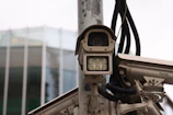 Close-up of physical protection systems including barriers and surveillance cameras.