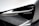 A close-up view of a modern car headlight, featuring sleek lines and a futuristic design. The light assembly is integrated into a metallic silver body with sharp angles, contributing to a high-tech aesthetic.